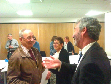 Walter Sanger (left) being congratulated by Alec Robertson, the Council Leader