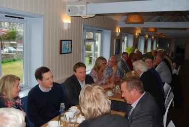  Photo George Osborne chats with local business owners with Derek  Thomas in Por